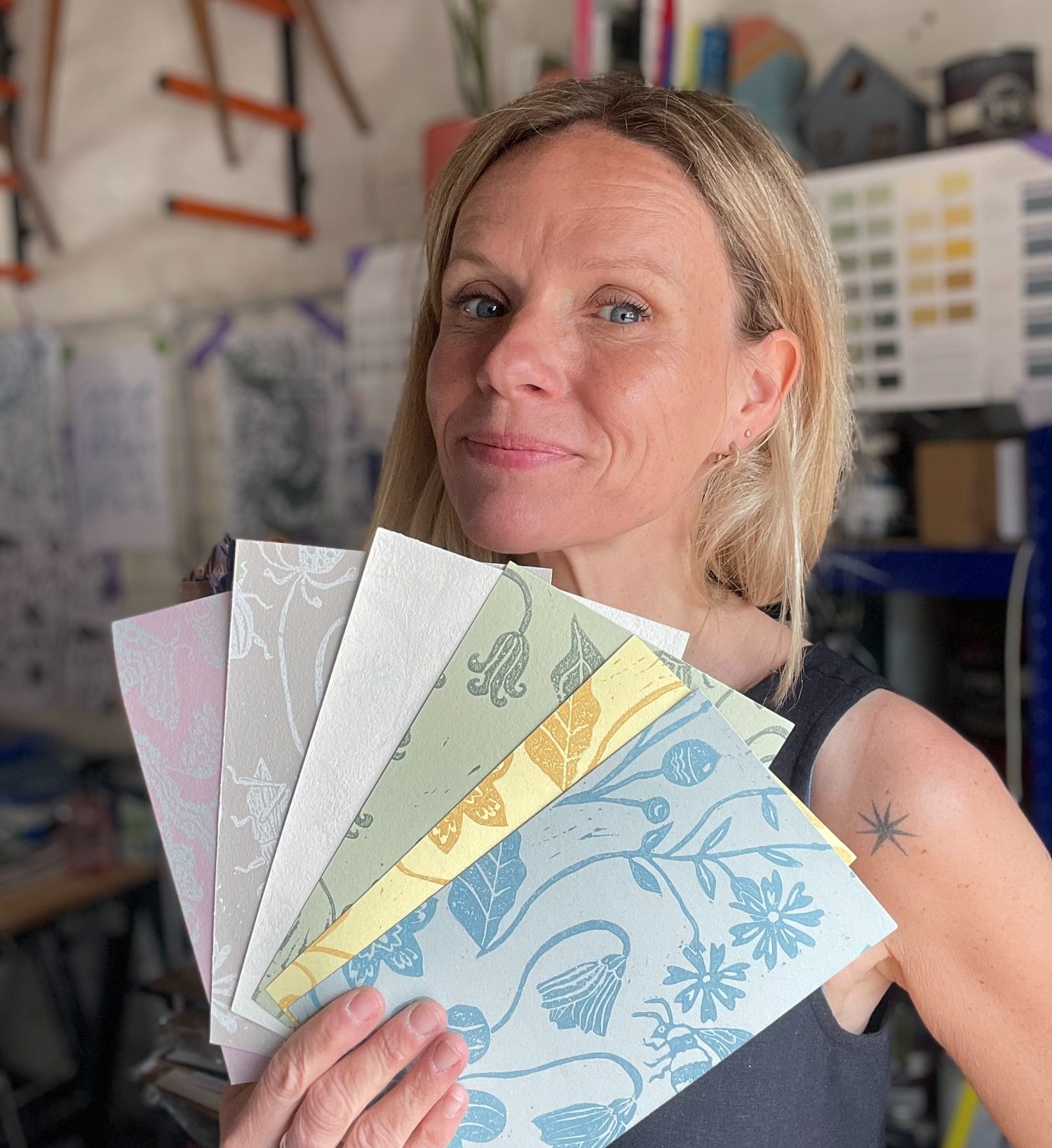 Wallpaper Samples Laura Wilkes holding Handmade Wallpaper Samples